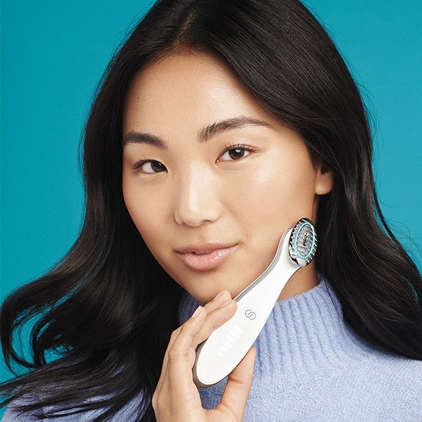 ageLOC Boost model image Woman holding ageLOC Boost